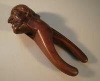 A late 19thC/early 20thC novelty treen nut cracker