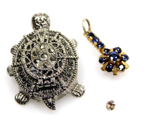 One diamond stone, a sapphire pendant, set in yellow metal, and a Le Chat marcasite set cased novelty watch formed as a tortoise.