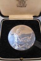 An early 20thC silver medallion presented for Special Distinction