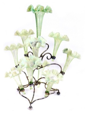 A late Victorian silver plated nine branch epergne, each glass shade of trumpet form with handkerchief shaped rim, in opalescent green and white, 50cm high.