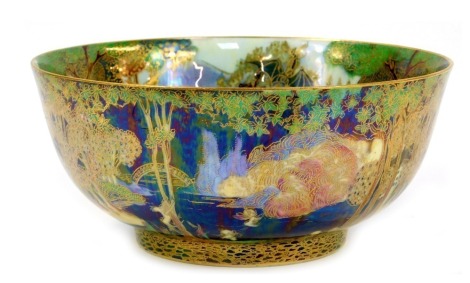 A Wedgwood Fairyland lustre bowl, designed by Daisy Makeig-Jones, the exterior decorated in the Woodland Bridge I pattern, the interior decorated in the Picnic by a River pattern, printed marks to underside and numbered Z4968, 20.5cm diameter.