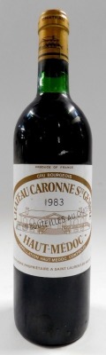 A bottle of Chateau Caronne Ste Gemme 1983 Haut-Medoc red wine, bottle of Cornas 1982 red wine, and bottle of Caves Syndicates de Bourgogne 195? wine (label AF). (3) - 3