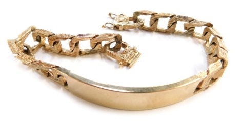 An Elizabeth II gold identity bracelet, with bark effect S shaped links, London 1991, 38.3g, 21cm long.