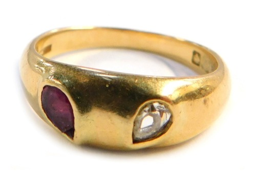 An Edwardian 18ct gold gypsy ring, set with pear cut ruby and diamond stones, Birmingham 1909, size P 1/2, 5.9g all in.