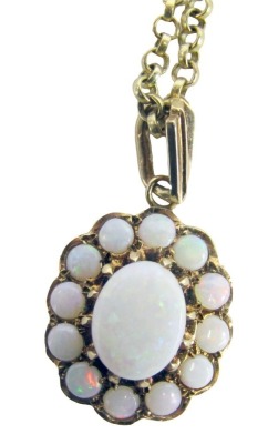 A 9ct gold and opal floral pendant and chain, the oval pendant set with an arrangement of oval and round cut stones in a claw setting, 2cm high, on a curb link neck chain, with top loop and clasp only marked 375, 44cm long, 7.6g all in.