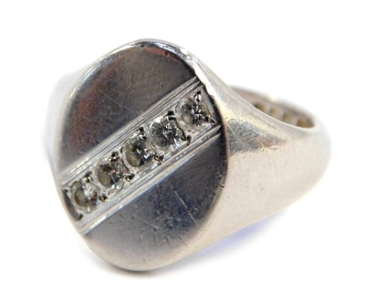 A platinum gentleman's signet ring, with oval plate set with five small diamonds, size O, 14g all in.