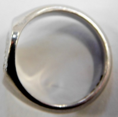 A platinum gentleman's signet ring, with oval plate set with five small diamonds, size O, 14g all in. - 2