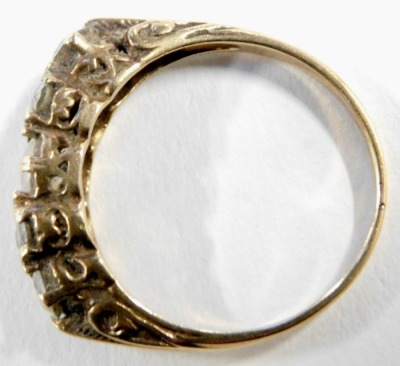 A 9ct gold diamond dress ring, set with seven imitation diamonds, possibly CZs, size N 1/2, 3g all in. - 2