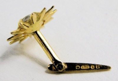 A pair of flower head design ear studs, yellow metal, set with white paste, stamped AJCD. - 2
