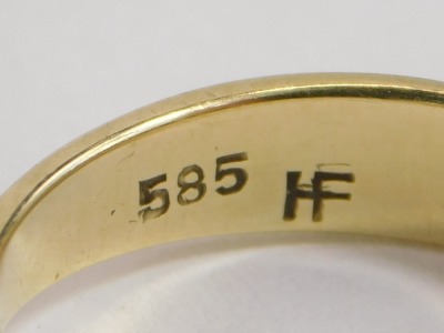 A pair of Chinese jadeite set ear studs, yellow metal, within pierced scroll borders, stamped China 14k, yellow metal ring set with a cultured pearl, stamped 585, 4.6g all in, and a yellow metal wedding band, indistinct marks, 3.7g. (3) - 2