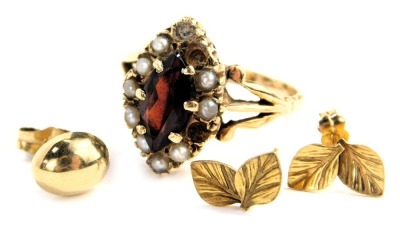 A 9ct gold lozenge shaped garnet and seed pearl ring, two seed pearls missing, a pair of ear studs, and a yellow metal ear stud, total weight 3.7g all in.