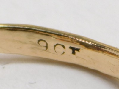 A 9ct gold lozenge shaped garnet and seed pearl ring, two seed pearls missing, a pair of ear studs, and a yellow metal ear stud, total weight 3.7g all in. - 2