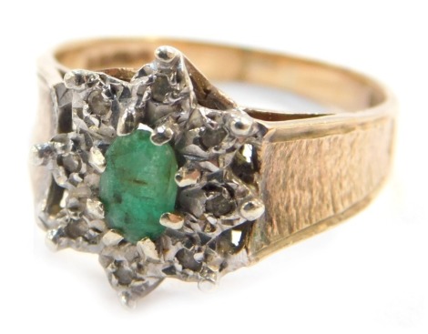 A 9ct gold emerald and diamond flower head dress ring, size P, 4.1g all in.