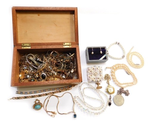 A burr walnut lidded jewellery box, containing costume jewellery and watches.