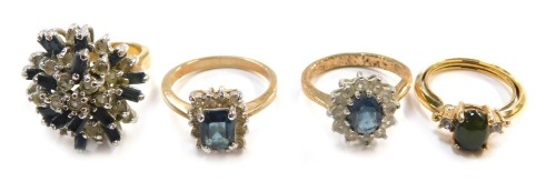 Four costume dress rings.