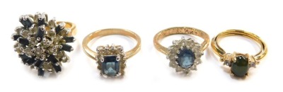 Four costume dress rings.
