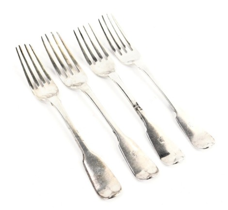 A set of four George IV silver fiddle pattern table forks, initial engraved, London 1823 and 1826, 8.10oz.