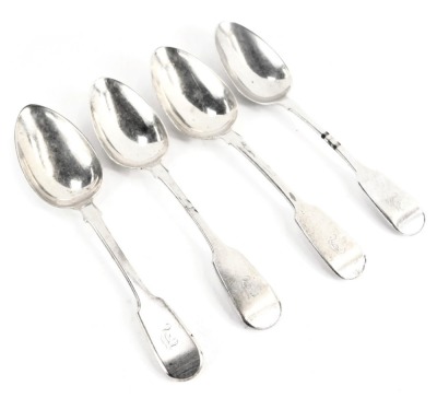 Four George III silver fiddle pattern dessert spoons, initial engraved, London 1763, 1792 and 1794, 5.79oz.