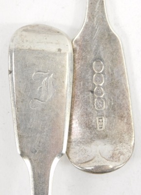 Four George III silver fiddle pattern dessert spoons, initial engraved, London 1763, 1792 and 1794, 5.79oz. - 2