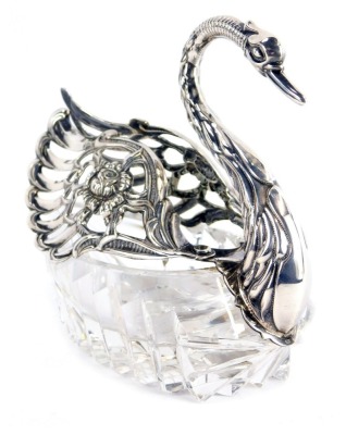A 20thC cut glass and silver salt dish, of swan form, with hinged pierced wings marked 925, 10cm high.