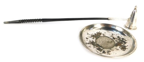 An Elizabeth II silver dish, of circular form inset with a commemorative Churchill 1965 crown, hallmarks rubbed, 2.57oz all in, 10cm diameter, together with a silver candle snuffer with turned handle, Birmingham 1968.