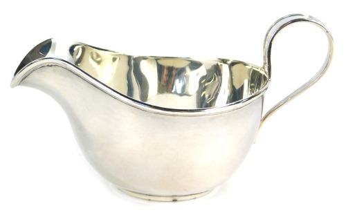 A George V silver cream jug, of plain form, James Dixon and Sons Ltd, Sheffield 1922, 1.98oz, 7cm high.