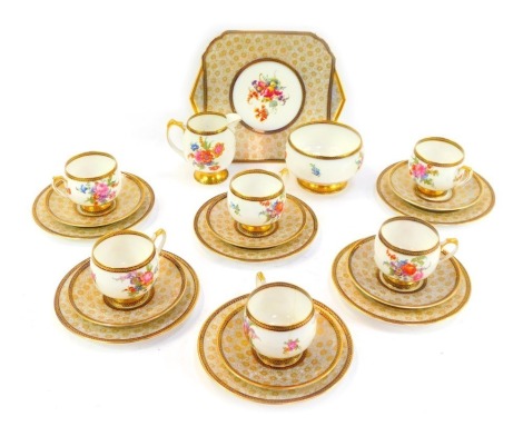 A Shelley porcelain part tea service, each piece decorated with transfer printed flowers against a gilt floral ground, H12611SE, printed marks to underside and registration number 823342, comprising six teacups, five saucers, milk jug, sugar bowl, six cak