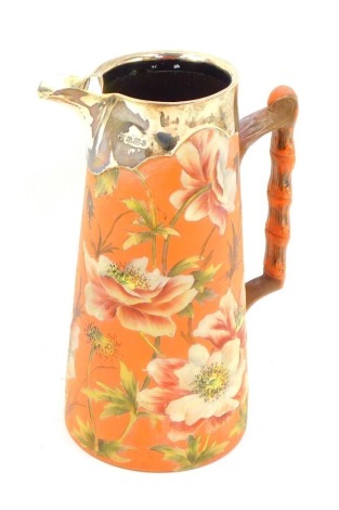 A late Victorian Langley ware jug, of cylindrical tapering form, with silver spout and rim, the body decorated with incised flowers and leaves, impressed marks, Sheffield 1895, 22cm high.