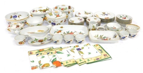 A group of Royal Worcester Evesham pattern tea and dinner wares, to include teacups and saucers, tureens and covers, serving dishes, breakfast bowls, gravy boat and saucer, etc., some seconds.