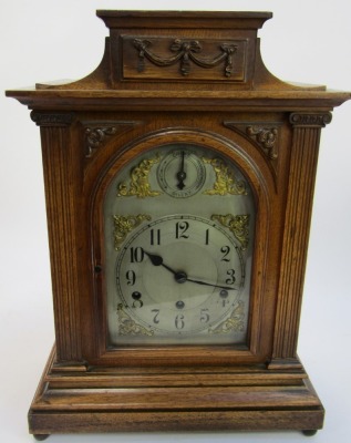 A late 19thC/early 20thC oak cased mantel clock, with a silvered Arabic numeric dial, with chime and silent, Westminster chime, 50cm high, 33cm wide, 19cm deep. - 2