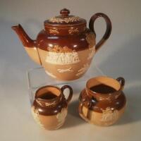 A Lambeth Doulton stoneware three piece tea set