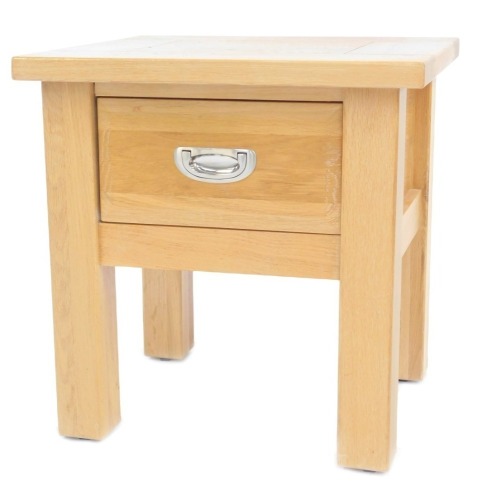 A Willis and Gambier oak bedside table, with frieze drawer, on stiles, 51cm high, 50cm wide, 44cm deep.