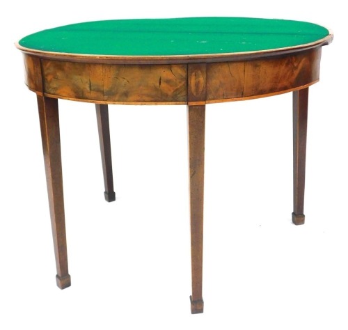 A George III mahogany demi lune card table, with rosewood cross banding, opening to reveal a baize interior, raised on tapering square legs, on spade feet, 73cm high, 92cm wide, 45.5cm deep. (AF)