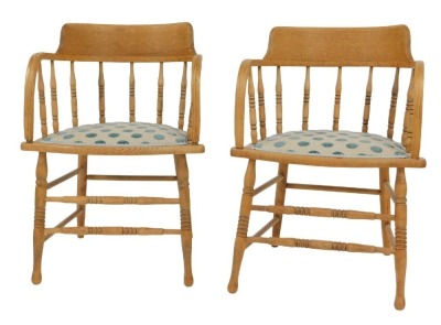 A pair of late Victorian light oak captain's chairs, 55cm wide.