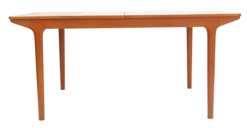 A mid century McIntosh teak draw leaf dining table, raised on turned legs, 74cm high, 160cm wide, 236cm extended, 91.5cm deep.