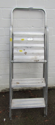 A metal folding three step ladder.