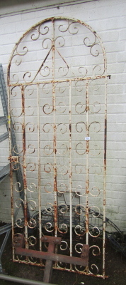 A painted wrought iron gate, of arched form, 85cm wide, together with an arched metal plant pot stand, etc. (a quantity)