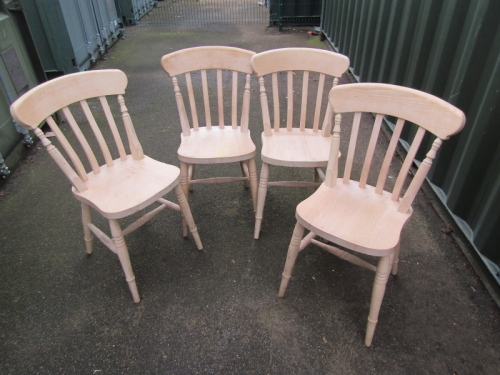 A set of four beech kitchen chairs. With the option of the next lot at the same price.