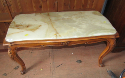 A walnut occasional table, with onyx top, 45cm high, the top 47cm x 92cm.