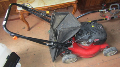 An MTD Thor petrol lawn mower.