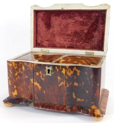 A Georgian tortoiseshell serpentine tea caddy, with silver and ivory inlay, the hinged lid opening to reveal two lidded compartments, raised on bun feet, 20cm wide. - 2