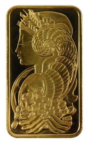 A Saudi Arabian fine gold ingot, the front displayed with lady with cornucopia of coins, the reverse marked Pmap Suisse 50g Fein Gold 999.9 chiasso, in plastic sealed case.