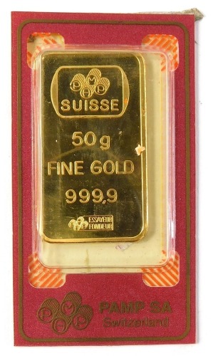 A Saudi Arabian fine gold ingot, the front displayed with lady with cornucopia of coins, the reverse marked Pmap Suisse 50g Fein Gold 999.9 chiasso, in plastic sealed case.