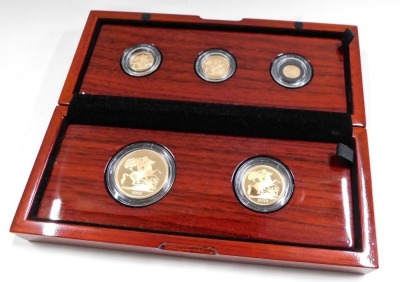 A Royal Mint The Sovereign cased sovereign set, comprising five pound, two pound, full, half, and quarter sovereign set for 2023, in mahogany presentation pack, with certificate, boxed. (5) - 2