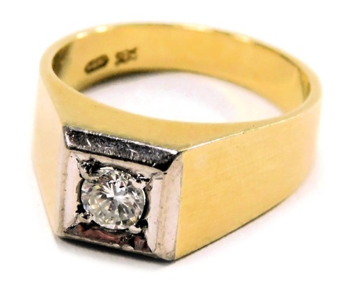 A diamond solitaire ring, the raised panel in a white gold setting with a central diamond approx 0.20ct, on a yellow metal band stamped 585 14k, ring size Q, 6.5g all in.