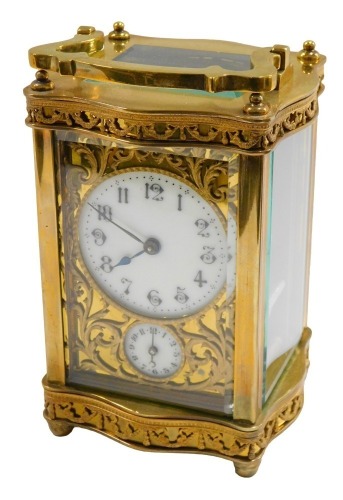 A late 19thC brass carriage clock, the circular enamel dial bearing Arabic numerals, subsidiary seconds, scroll spandrels, the case with Adam style bows and swags decoration to the top and lower section of the case, single barrel movement numbered 23978,