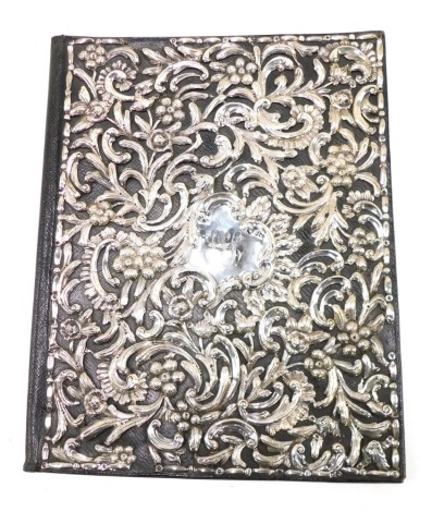 A late 19thC black leather and silver desk blotter, embossed with floral scroll work and centred by a monogrammed cartouche, circa 1890, 40cm x 33cm. Provenance: Sotheby's sale at Easton lot number 1012, dated 17th-19th May 2005, with sale catalogue.