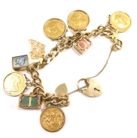 A 9ct gold charm bracelet, on curb link bracelet with safety chain and heart shaped padlocks, arrangement of charms to include five full gold sovereigns dated 1889, 1872, 1914, 1900 and 1899, note charms, etc., 14cm long, 93.3g all in.