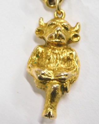 A Lincoln Imp pendant and chain, the yellow metal Lincoln Imp stamped 9ct, 3cm high, on a two row fancy link necklace, yellow metal stamped 18k, 50cm long, 76.1g all in. - 2