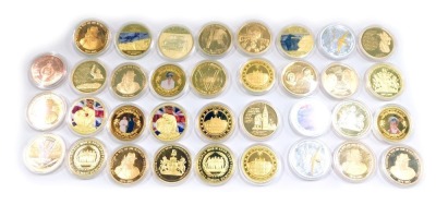 A collection of commemorative coins, for WWI, The Royal Family, Churchill and others, each in presentation pack.